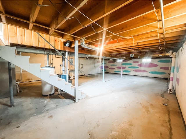 unfinished basement featuring stairway