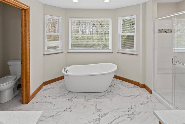 full bathroom featuring a shower stall, marble finish floor, baseboards, and recessed lighting