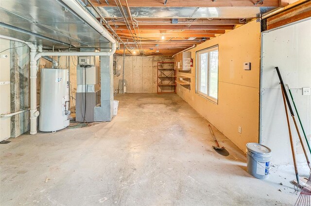 basement featuring heating unit and gas water heater
