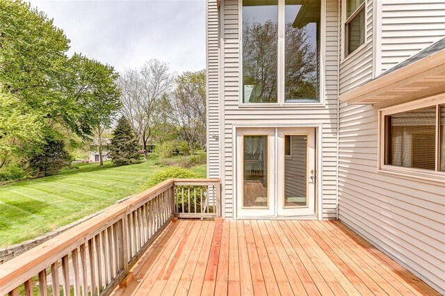 wooden terrace with a yard