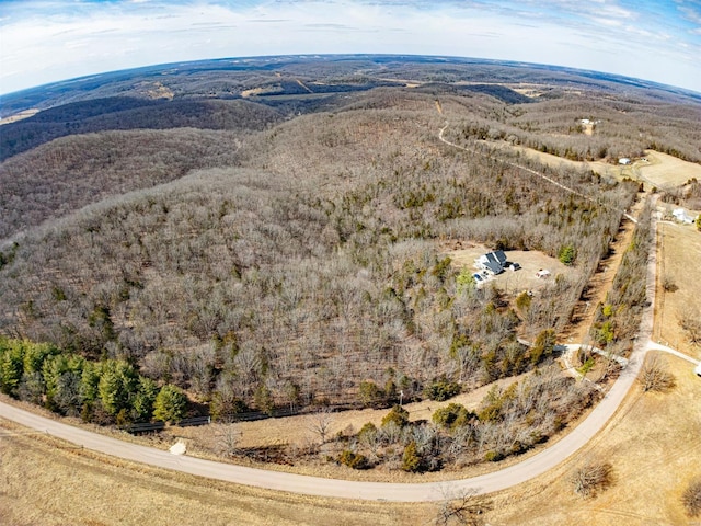 drone / aerial view featuring a view of trees