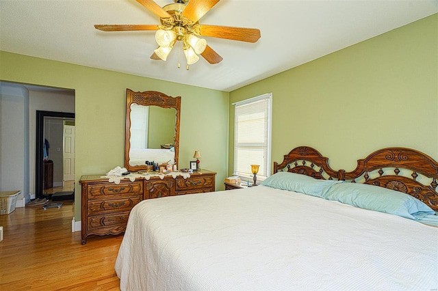 bedroom featuring a ceiling fan and light wood-style flooring