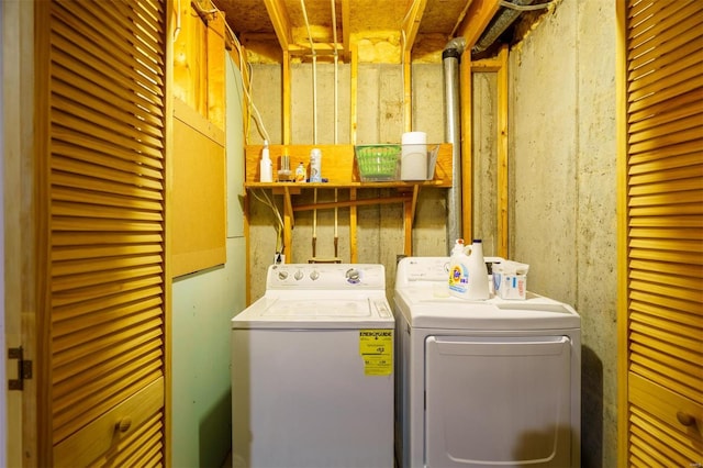 washroom featuring washer and clothes dryer and laundry area