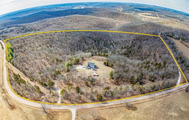 aerial view featuring a view of trees