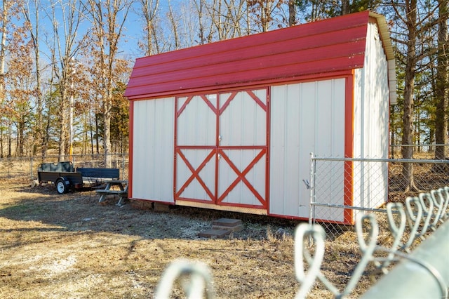 view of shed with fence