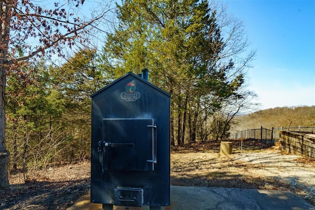 view of outdoor structure with fence