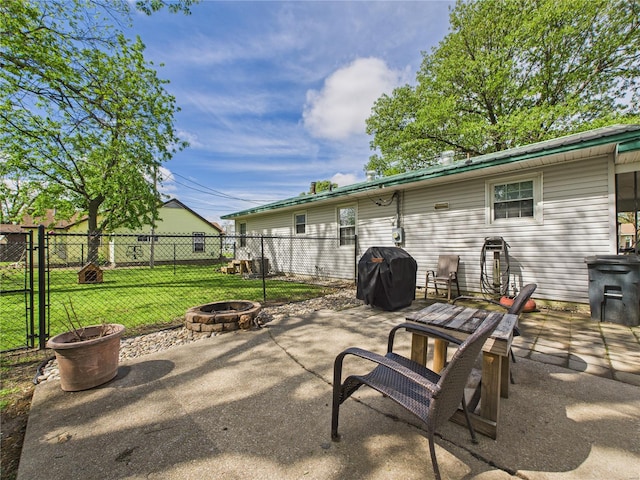 view of patio with fence, an outdoor fire pit, and area for grilling