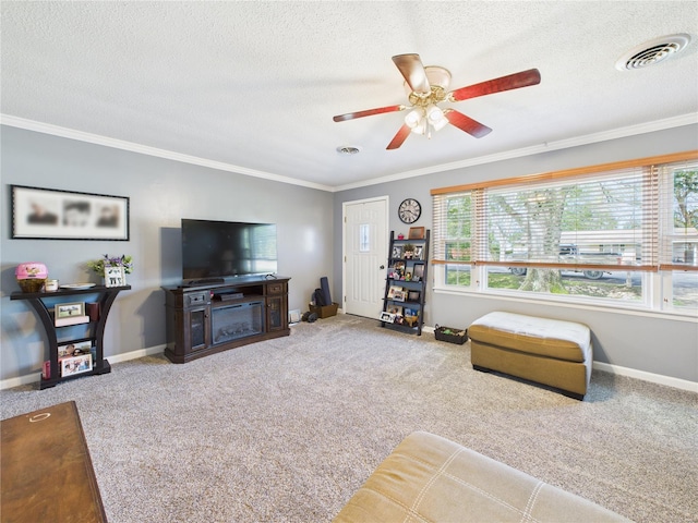 carpeted living area with a textured ceiling, visible vents, crown molding, and baseboards