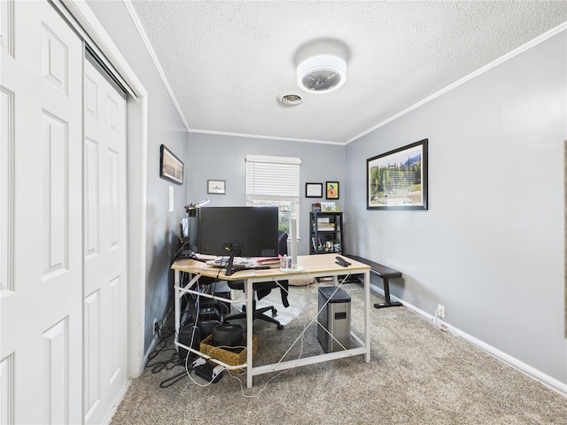 carpeted home office featuring baseboards, crown molding, a textured ceiling, and visible vents