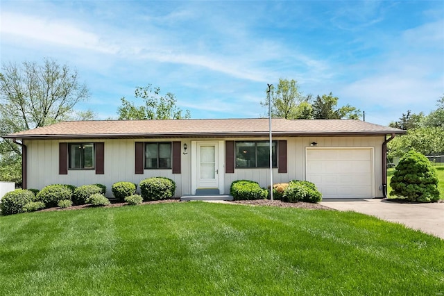 ranch-style home with concrete driveway, an attached garage, and a front yard