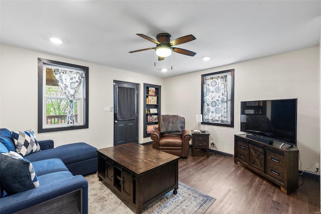 living room featuring recessed lighting, a ceiling fan, and wood finished floors
