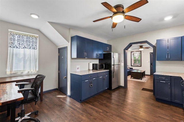 kitchen with a ceiling fan, stainless steel appliances, and blue cabinetry