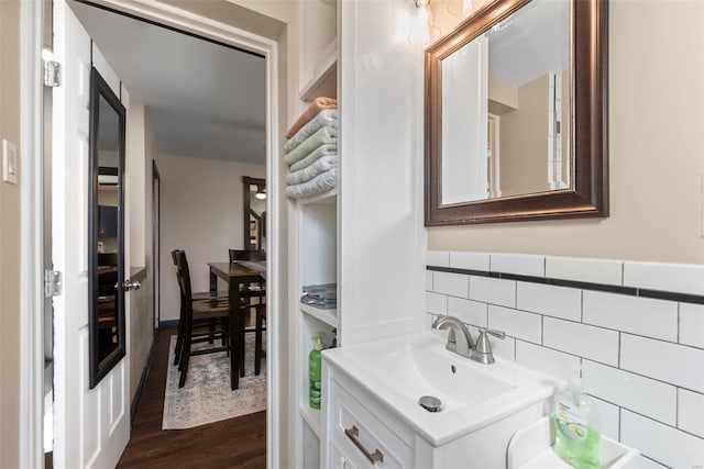 bathroom with vanity and wood finished floors