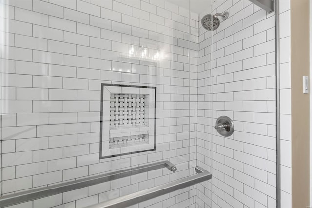 full bath with a tile shower