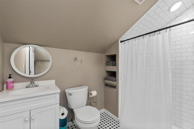 full bathroom featuring vanity, curtained shower, vaulted ceiling, and toilet