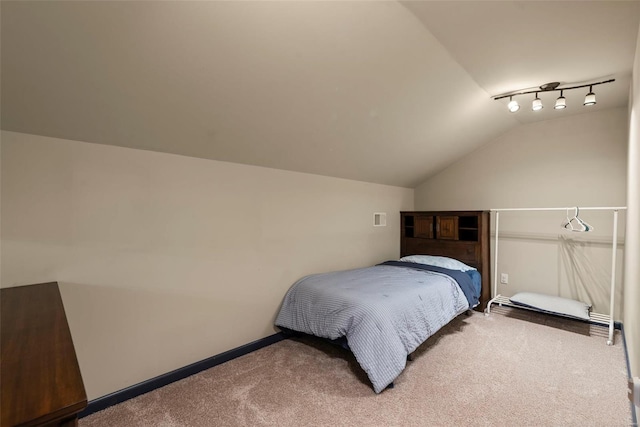 carpeted bedroom with baseboards, visible vents, and lofted ceiling