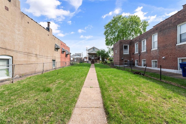 view of property's community featuring fence and a residential view