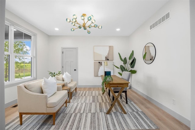 interior space with visible vents, an inviting chandelier, baseboards, light wood-type flooring, and recessed lighting