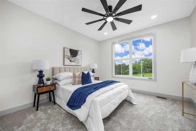 bedroom with carpet floors, baseboards, and visible vents