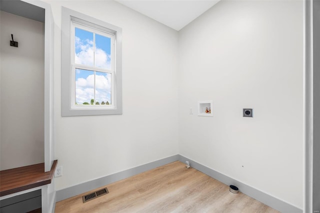 laundry area featuring visible vents, laundry area, baseboards, electric dryer hookup, and washer hookup