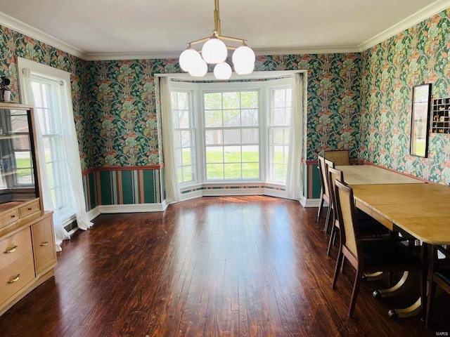 dining area with dark wood-type flooring, wallpapered walls, and ornamental molding