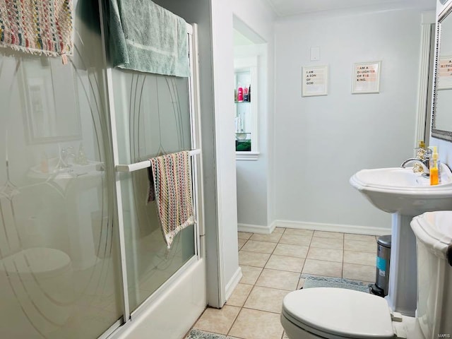 full bath featuring tile patterned floors, baseboards, and toilet