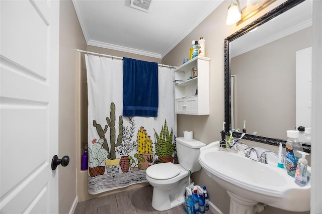 full bathroom with crown molding, a sink, visible vents, toilet, and wood finished floors