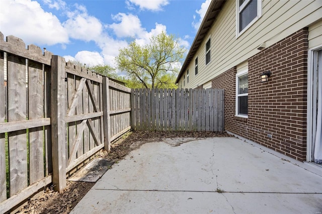 view of patio / terrace featuring fence