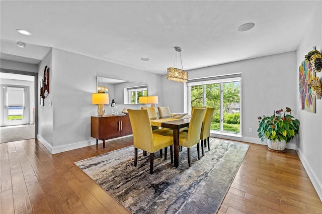 dining space with recessed lighting, baseboards, and hardwood / wood-style floors