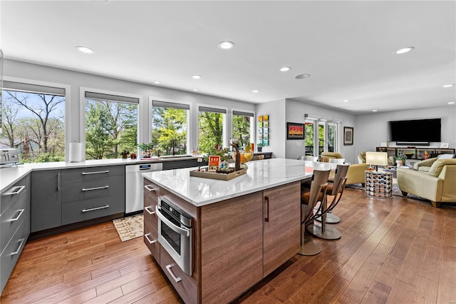 kitchen featuring recessed lighting, a kitchen island, and stainless steel appliances