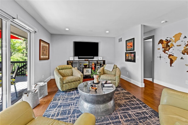 living room with recessed lighting, baseboards, visible vents, and wood finished floors