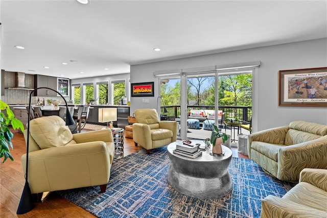 living room with recessed lighting and wood finished floors