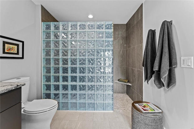 bathroom with walk in shower and toilet