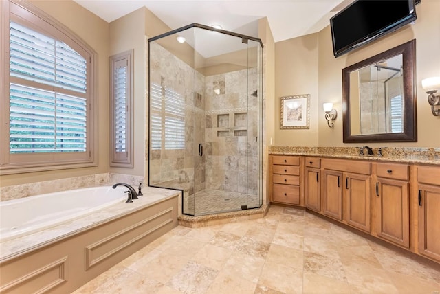 bathroom with vanity, a stall shower, and a bath