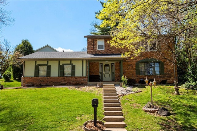 traditional-style house with brick siding and a front lawn
