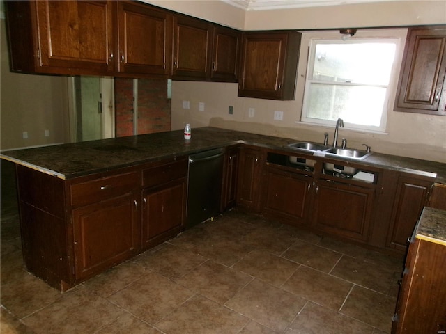 kitchen featuring dishwasher, a peninsula, and a sink