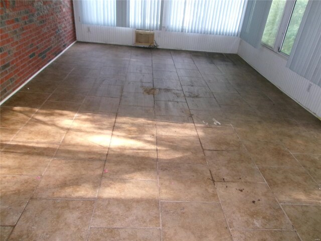 spare room with brick wall