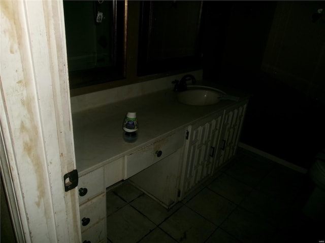 bathroom with tile patterned flooring and vanity