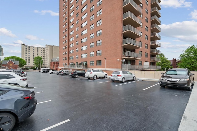 view of property featuring uncovered parking