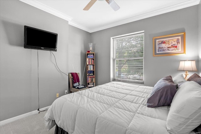 bedroom with crown molding, a ceiling fan, baseboards, and carpet