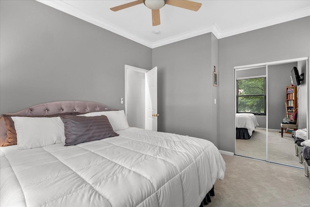 bedroom with crown molding, ceiling fan, baseboards, and carpet