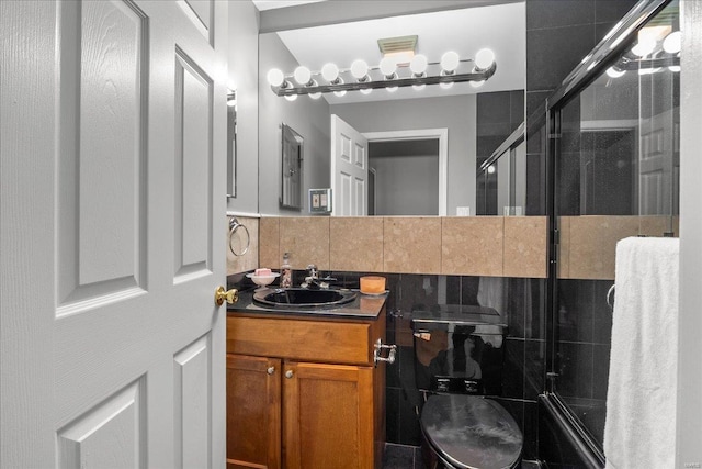 full bathroom with vanity, backsplash, and a tile shower