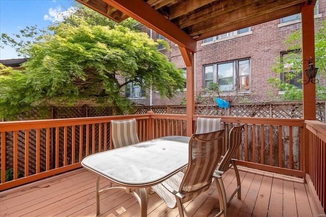 wooden terrace featuring outdoor dining space