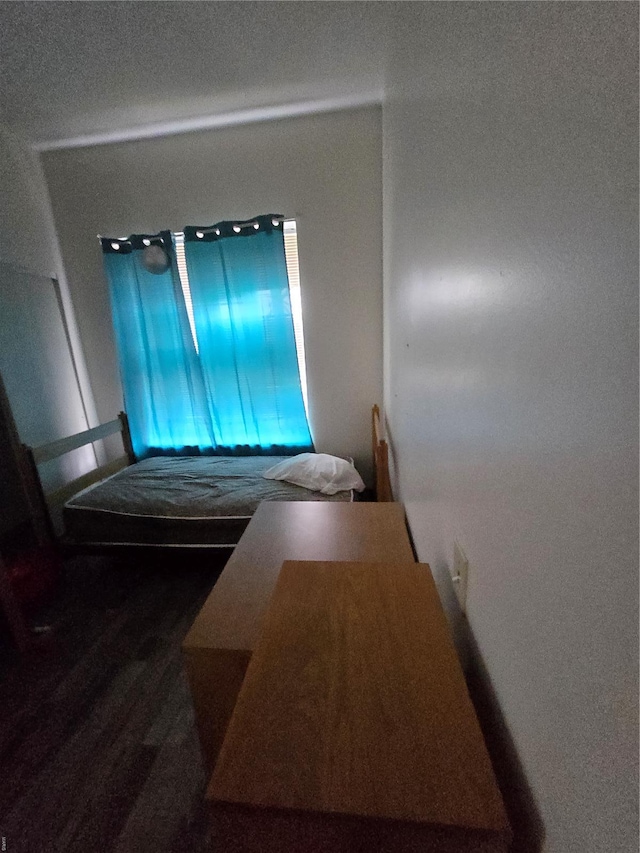 bedroom featuring wood finished floors