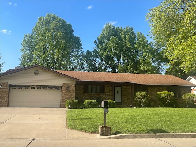 ranch-style house with an attached garage, a front lawn, brick siding, and concrete driveway