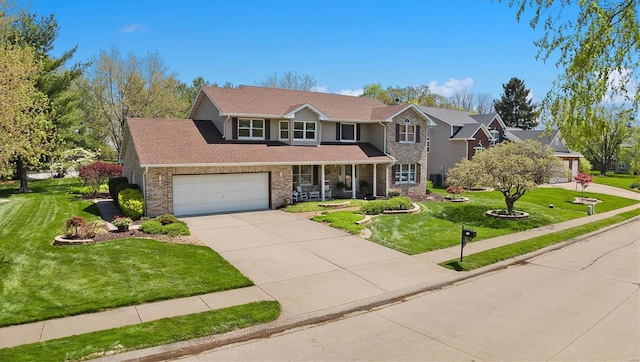 traditional-style home with stone siding, covered porch, concrete driveway, a garage, and a front yard