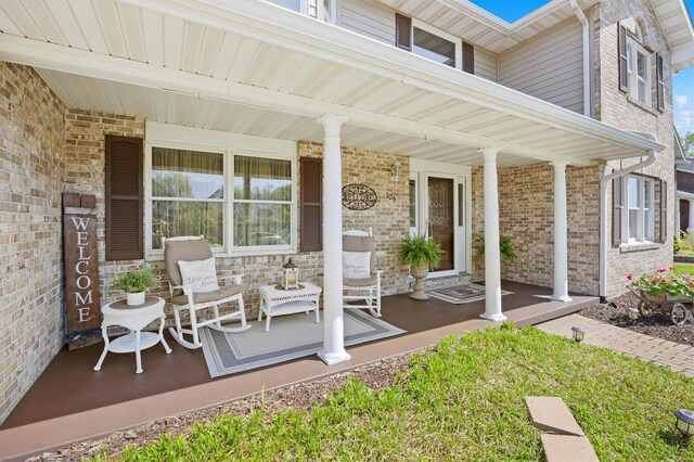 view of patio featuring a porch