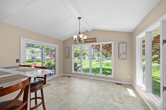 dining space with lofted ceiling with beams, baseboards, a notable chandelier, and plenty of natural light