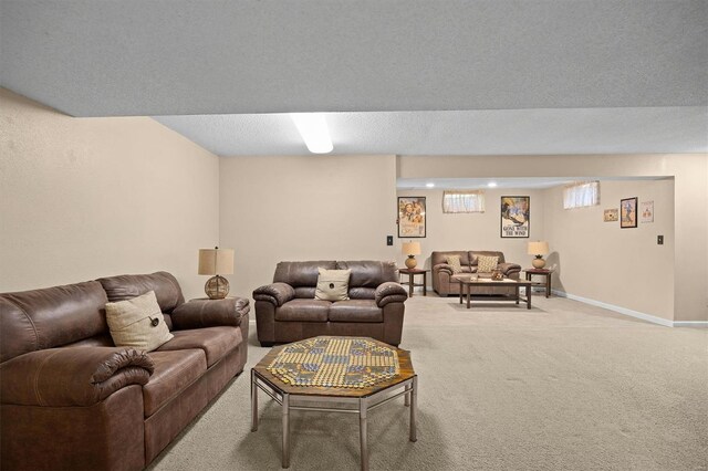 living area featuring baseboards and light colored carpet