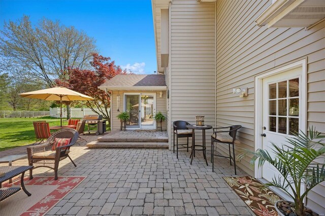 view of patio / terrace featuring grilling area and fence